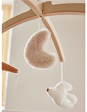 Noukie's mobile musical bras en bois Bali, Moka & Snow N2450.50